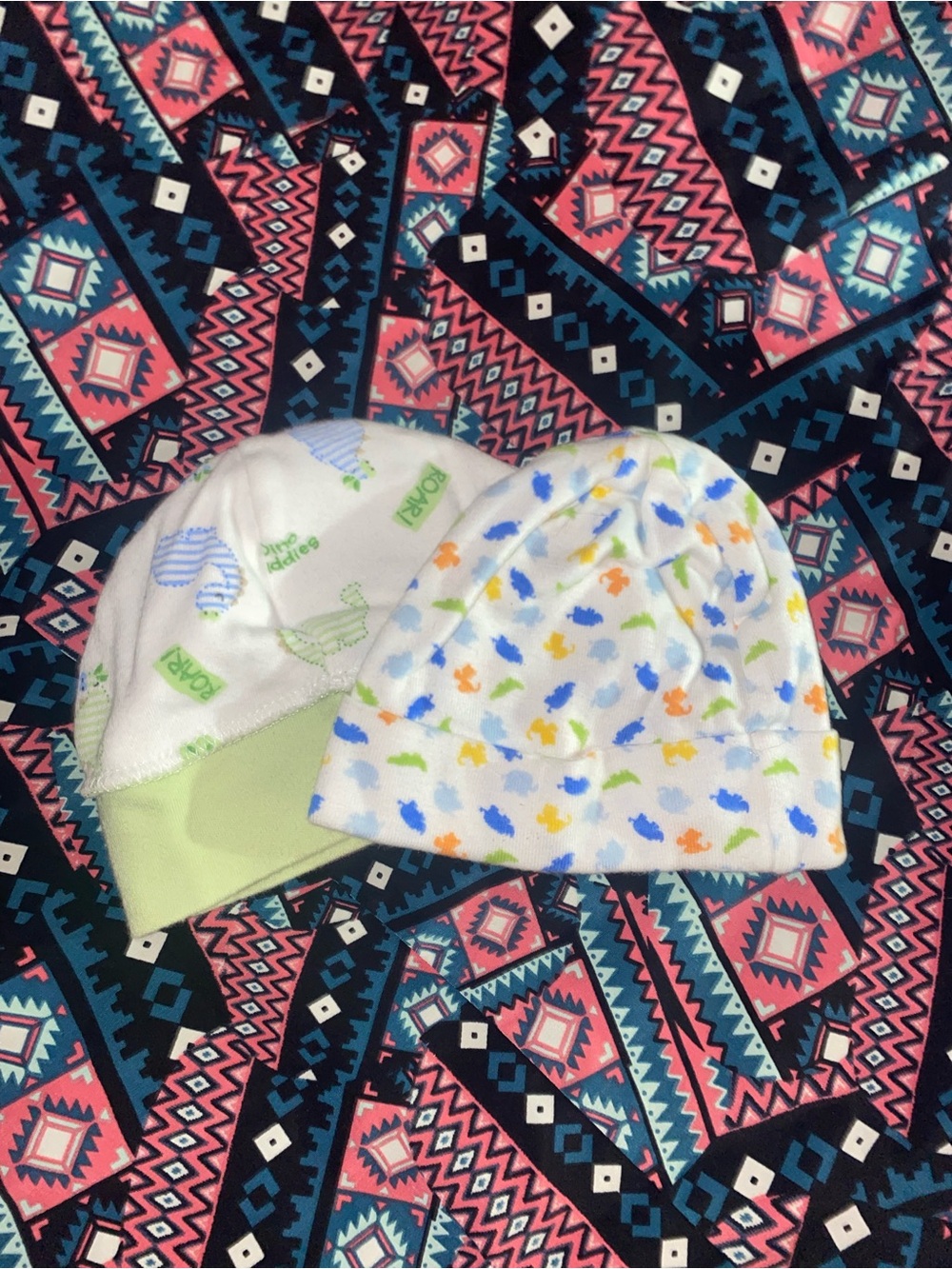Gerber Baby Beanie Duo in dinosaur themes.